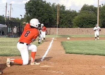 Tiger hitter Jayden Huitt hits the ball down the third baseline during the first game of the season against Granite. Photos by Tania Huitt