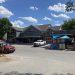 Construction continues on Diamondback Harley-Davison’s Medicine Park clothing outlet Wednesday afternoon. Inside a crew member makes some adjustments to the retail center’s patio doors overlooking Bath Lake. The shop is expected to open mid to late August. Pphoto by Curtis Awbrey
