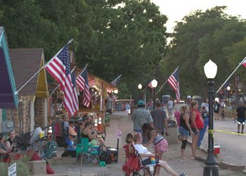 Attendees listen to music during a previous Rock The Park festival and Fourth of July Celebration in Medicine Park. Jeremy Robbins/File Photo