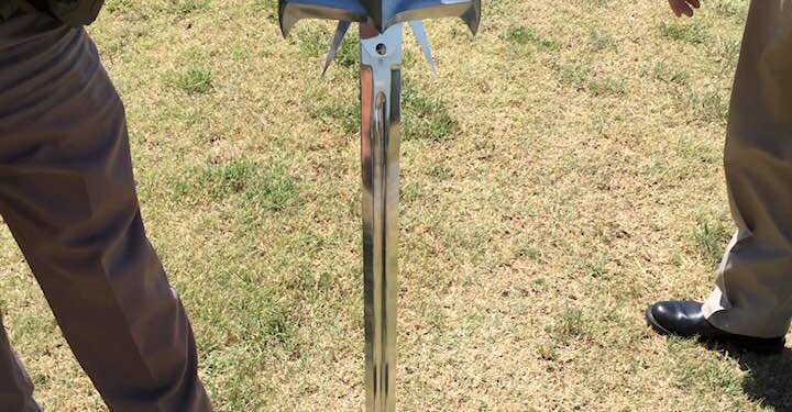Brandishing this sword, Robert Sturgis Powers is accused of threatening a Hilliary Communications employee and stabbing the front tires of a company bucket truck