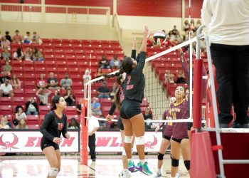 Amaya Rodriguez, right, tallies one of her 13 kills during Tuesday’s match at Clinton. Elgin won each set by scores of 25-17, 25-15 and 25-11. Photo by Rebecca Harvey