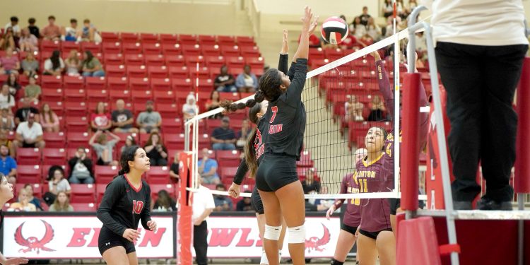 Amaya Rodriguez, right, tallies one of her 13 kills during Tuesday’s match at Clinton. Elgin won each set by scores of 25-17, 25-15 and 25-11. Photo by Rebecca Harvey