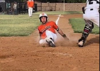 Sterling’s Nate Anderson slides home for one of the Tigers’ four runs in the season opening loss to Granite. Photos by Tania Huitt