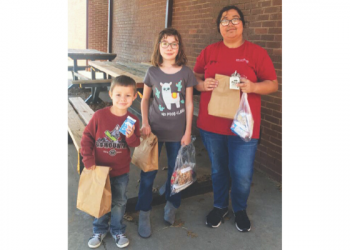Qualified to provide meals to students during the recent closures due to COVID-19, Fletcher Public Schools has been handing out to-go sack lunches for kids in the district. On Tuesday, March 24, FPS senior Lauren Givens, Leila Kerrick, fifth grade, and Matthew Givens, Pre-K, walked to the school to retrieve their sack lunch