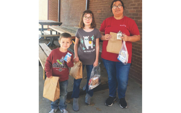 Qualified to provide meals to students during the recent closures due to COVID-19, Fletcher Public Schools has been handing out to-go sack lunches for kids in the district. On Tuesday, March 24, FPS senior Lauren Givens, Leila Kerrick, fifth grade, and Matthew Givens, Pre-K, walked to the school to retrieve their sack lunch