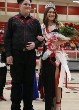 Spring homecoming Queen Mikayla Arnold, right, smiles to the crowd after being crowned Tuesday night. At her left is homecoming King Hunter McDonald. The ceremony occurred before the start of the girls varsity basketball game. Arnold represented Elgin’s slow-pitch softball team. RIP STELL | SOUTHWEST CHRONICLE