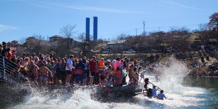 Jumpers enjoy mild temps for Medicine Park’s Polar Plunge