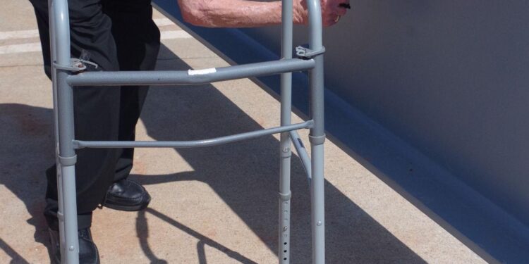 Airport staff, officers, contractors put names to final beam in holding area project