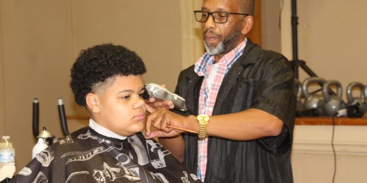 Kids enjoy fun, food, free haircuts at back-to-school event