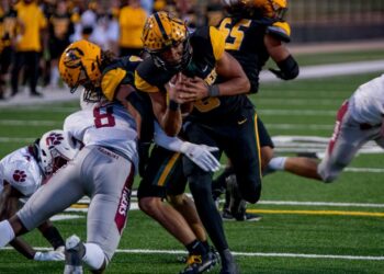 Onside kick recoveries ignite Mac victory