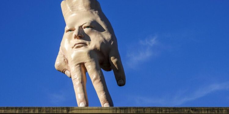 A New Zealand city waves goodbye to its 'disturbing' giant hand sculpture that many came to love